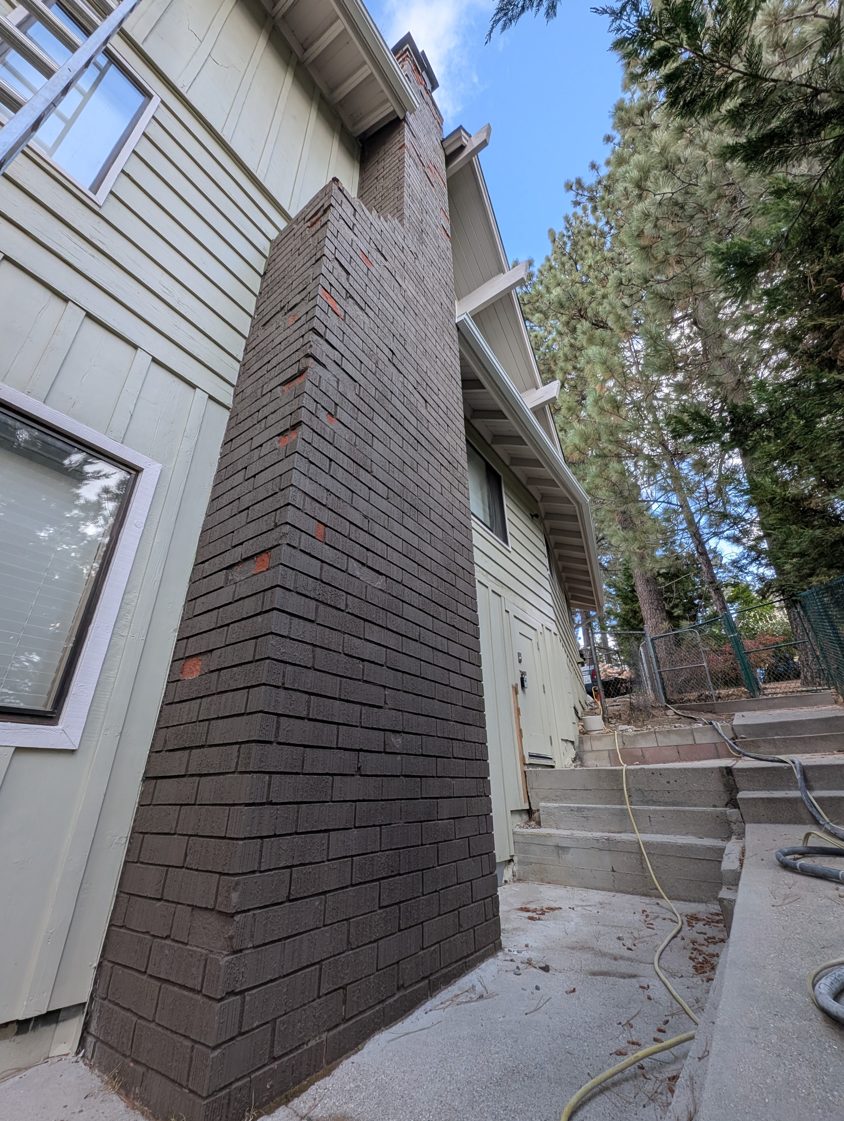 Side view of painted chimney before soft media blasting, Big Bear CA